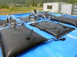 懸濁・除去法で排出された泥水のフレコンバッグを通した排水による減容化（福島県）
